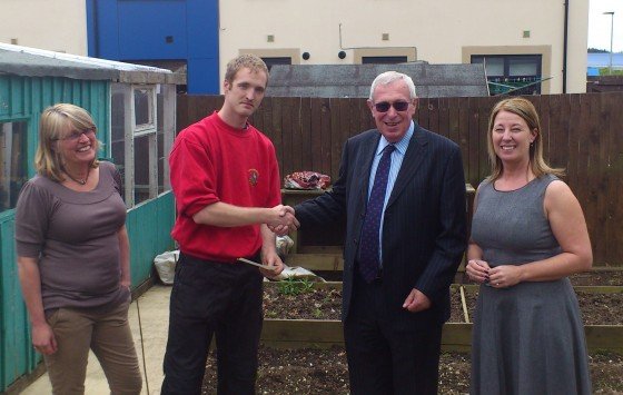 Standing in front of the new shed L-R: Church Housing Trust Director Miriam Morris, The Beacon resident Christian, Church Housing Trust Chairman Bob Cribb, Riverside Team Leader Sheryl West
