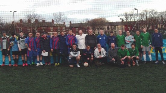 Footballers from homelessness services across Liverpool pose together