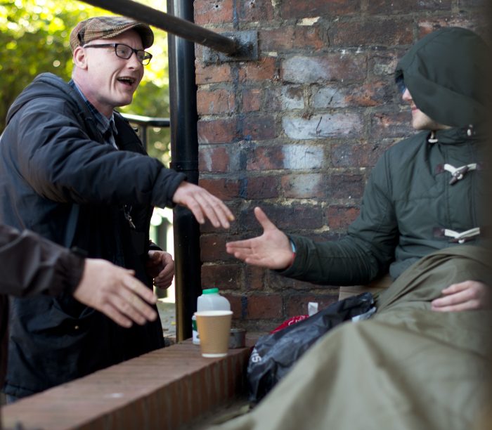 Street Buddies outreach volunteer greeting rough sleeper