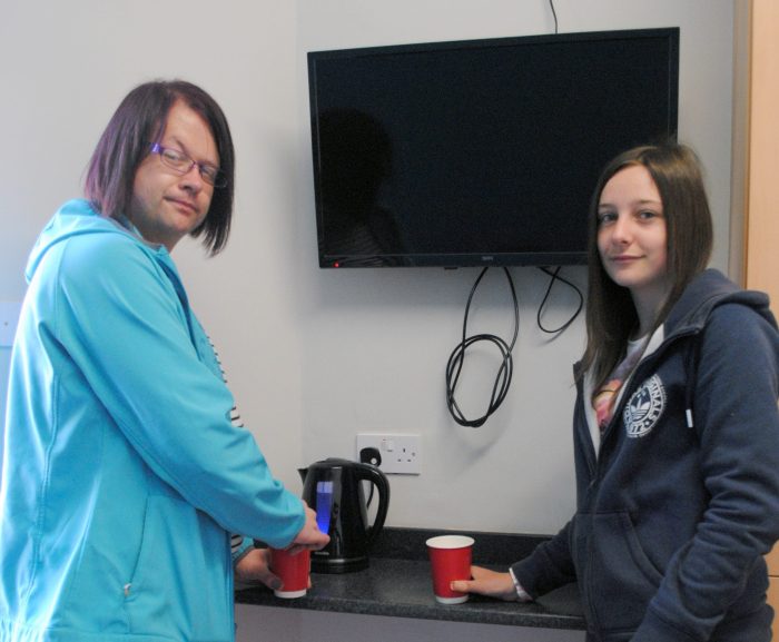 Tim and Becky hang out in the newly decorated lounge of their hostel