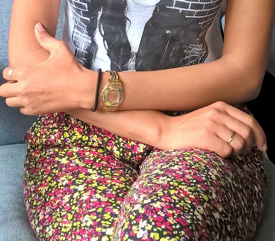 Young woman's arms folded