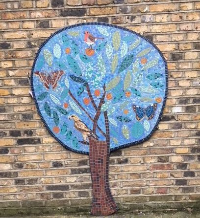 Mosaic of tree on the wall at Queen Mary's hostel