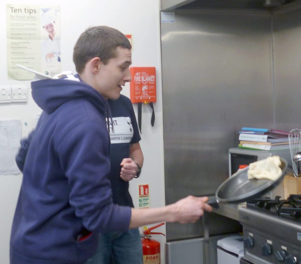 Breakfast club at Cangle Foyer - young man flipping pancakes