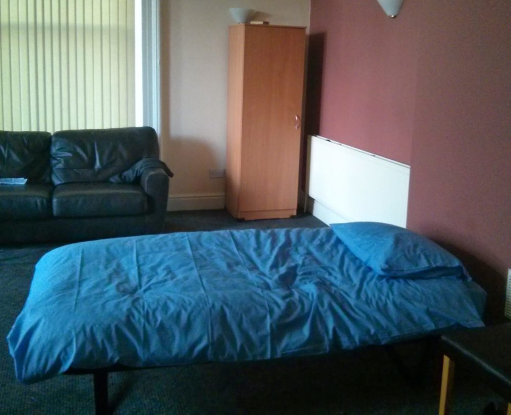Emergency sit up bed in living room