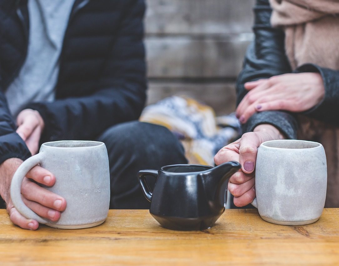 Two people having tea