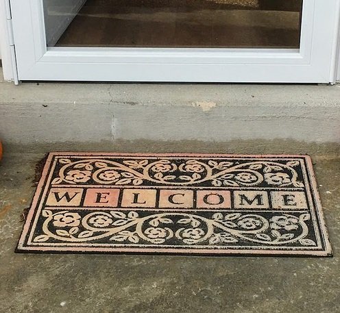 Welcome mat outside door