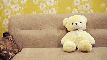 Teddy bear on sofa