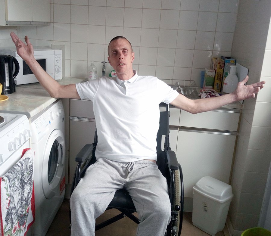 Man in wheelchair in kitchen