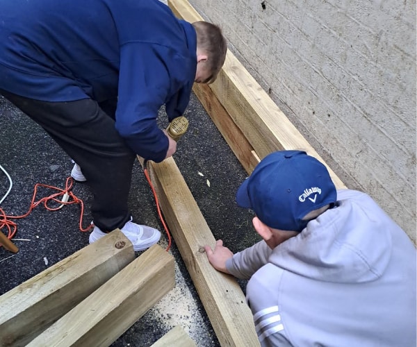 Residents building raised beds at King George’s Hostel, London