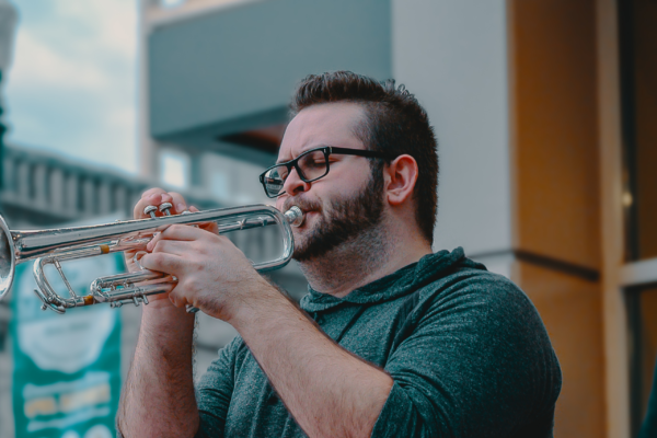 Photograph of a man playing the trumpet