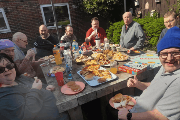 Photograph of a group of people sat around a table enjoying a easter buffet